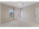 Bright bedroom with private balcony access and ceiling fan at 13029 Paddock Wood Pl, Riverview, FL 33579