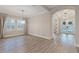 Bright dining room with hardwood floors and large windows at 13029 Paddock Wood Pl, Riverview, FL 33579
