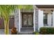 Elegant entryway with double doors and stone detailing at 13029 Paddock Wood Pl, Riverview, FL 33579