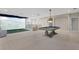Game room with pool table and golf simulator at 13029 Paddock Wood Pl, Riverview, FL 33579