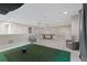Game room features a golf simulator and pool table at 13029 Paddock Wood Pl, Riverview, FL 33579