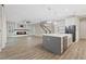 Open kitchen with island, stainless steel appliances, and white cabinetry at 13029 Paddock Wood Pl, Riverview, FL 33579