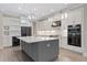Gourmet kitchen with large island, stainless steel appliances, and wine storage at 13029 Paddock Wood Pl, Riverview, FL 33579