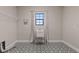 Bright laundry room with utility sink and patterned tile floor at 13029 Paddock Wood Pl, Riverview, FL 33579