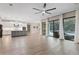 Spacious living area with sliding doors leading to a pool and patio at 13029 Paddock Wood Pl, Riverview, FL 33579