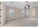 Spacious main bedroom with neutral decor, carpeted floors and window seating at 13029 Paddock Wood Pl, Riverview, FL 33579