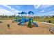 Modern playground with swings, slides, and climbing structures at 13029 Paddock Wood Pl, Riverview, FL 33579