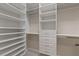 Large walk-in closet with ample shelving and drawer space at 13029 Paddock Wood Pl, Riverview, FL 33579