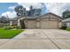 Two-car garage and well-maintained lawn at 2835 Laurel Leaf Dr, Valrico, FL 33594