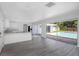 Open concept kitchen with island, stainless steel appliances, and pool view at 6685 17Th N St, St Petersburg, FL 33702