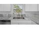 Kitchen features a double sink and modern appliances at 6685 17Th N St, St Petersburg, FL 33702