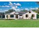Farmhouse style home with white siding, brown accents, and manicured lawn at 0 Castlewood Rd # Lot 3, Seffner, FL 33584