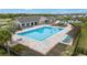 Community lap pool with lounge chairs and cabana at 13029 Paddock Wood Pl, Riverview, FL 33579