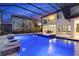 Enjoy this luxurious pool and spa with a covered patio area at 13029 Paddock Wood Pl, Riverview, FL 33579