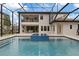 Resort-style pool and spa with a covered patio at 13029 Paddock Wood Pl, Riverview, FL 33579