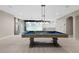 Basement recreation room with pool table and golf simulator at 13029 Paddock Wood Pl, Riverview, FL 33579
