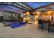 Relaxing pool and patio with outdoor bar and ambient lighting at 13029 Paddock Wood Pl, Riverview, FL 33579