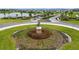 Impressive entrance to the community featuring a cyclist statue at 13029 Paddock Wood Pl, Riverview, FL 33579