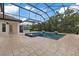 Inviting pool area with a built-in bar and covered patio at 13029 Paddock Wood Pl, Riverview, FL 33579