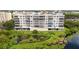 Multi-story building with water views and lush landscaping at 6551 Shoreline Dr # 6202, St Petersburg, FL 33708