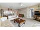 Bright living room features a comfortable seating area and a rustic coffee table at 6551 Shoreline Dr # 6202, St Petersburg, FL 33708