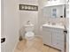 Clean bathroom with gray vanity, toilet and tile flooring at 2348 Silvermoss Dr, Wesley Chapel, FL 33544