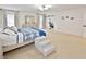 Spacious bedroom with a cozy bed and barn door closet access at 2348 Silvermoss Dr, Wesley Chapel, FL 33544