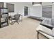 Home office with desk, chair, and comfortable seating at 2348 Silvermoss Dr, Wesley Chapel, FL 33544