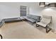 Relaxing sitting area with comfortable sofa and chair at 2348 Silvermoss Dr, Wesley Chapel, FL 33544