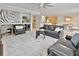 Spacious living room with leather couches and a large area rug at 2348 Silvermoss Dr, Wesley Chapel, FL 33544