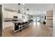 Open concept kitchen with island, stainless steel appliances, and white cabinets at 13012 Rain Lily Dr, Riverview, FL 33579