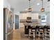 Open concept kitchen with island, stainless steel appliances, and white cabinets at 13012 Rain Lily Dr, Riverview, FL 33579