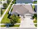Aerial view showing house, driveway, and landscaping at 13012 Rain Lily Dr, Riverview, FL 33579