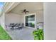 Covered patio with table, chairs, and grill at 13012 Rain Lily Dr, Riverview, FL 33579