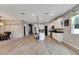 Open concept kitchen with white cabinets, granite countertops and an island at 13012 Rain Lily Dr, Riverview, FL 33579