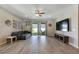 Relaxing living room featuring sliding doors to backyard at 13012 Rain Lily Dr, Riverview, FL 33579