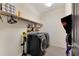 Laundry room with washer, dryer, and shelving at 13012 Rain Lily Dr, Riverview, FL 33579