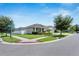 House exterior view with landscaping and street view at 13012 Rain Lily Dr, Riverview, FL 33579
