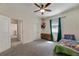 bedroom with carpeted floor and ceiling fan at 13012 Rain Lily Dr, Riverview, FL 33579