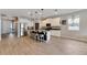 Modern kitchen featuring white cabinets, granite countertops, and a kitchen island at 13012 Rain Lily Dr, Riverview, FL 33579