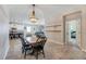 Bright dining room features a chandelier and seating for six at 13012 Rain Lily Dr, Riverview, FL 33579