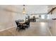 Open concept dining room with kitchen view and stylish chandelier at 13012 Rain Lily Dr, Riverview, FL 33579