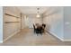Elegant dining room with chandelier and area rug at 13012 Rain Lily Dr, Riverview, FL 33579