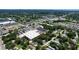Wide aerial view of a commercial area with a cityscape in the far distance and residential streets nearby at 4477 67Th N St, St Petersburg, FL 33709