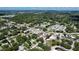 Aerial view reveals a tranquil neighborhood with mature trees and a mix of residential properties at 4477 67Th N St, St Petersburg, FL 33709