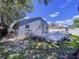 Backyard showcases a spacious wooden deck, perfect for outdoor entertaining and relaxation at 4477 67Th N St, St Petersburg, FL 33709