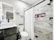 Updated bathroom featuring marble tile, glass-enclosed shower, and a modern vanity creating a spa-like experience at 4477 67Th N St, St Petersburg, FL 33709