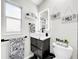 Stylish bathroom with a modern vessel sink, sleek vanity, decorative towels, and lit mirror at 4477 67Th N St, St Petersburg, FL 33709