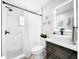 Modern bathroom showcasing marble-tiled shower, sleek vanity with vessel sink, and elegant fixtures at 4477 67Th N St, St Petersburg, FL 33709