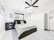Bright bedroom with a ceiling fan, closet, dresser, and a big window, all contributing to a comfortable aesthetic at 4477 67Th N St, St Petersburg, FL 33709